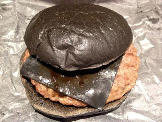 Illustration for article titled Burger King's all-black burger looks absolutely disgusting in real life